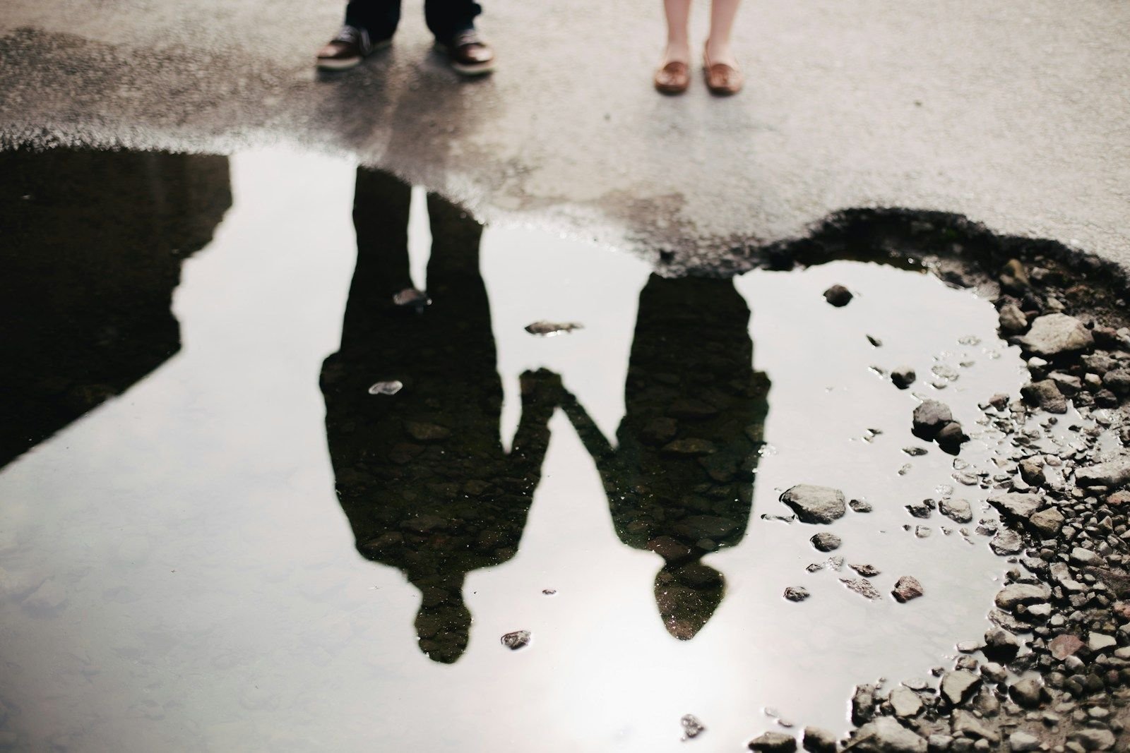 man and woman holding hand together